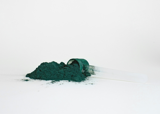 Spirulina powder and a scoop