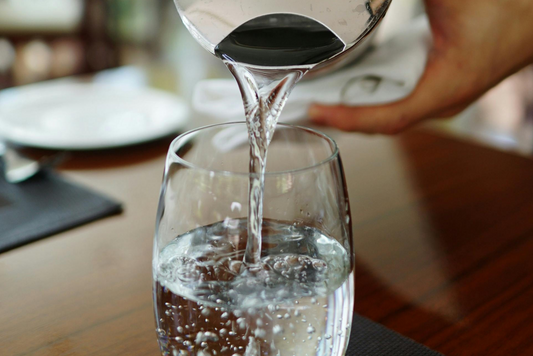 Pouring water into a glass